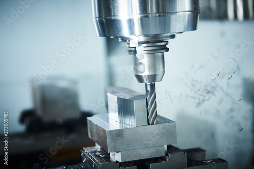 milling cnc machine at metal work industry. Multitool precision manufacturing and machining photo