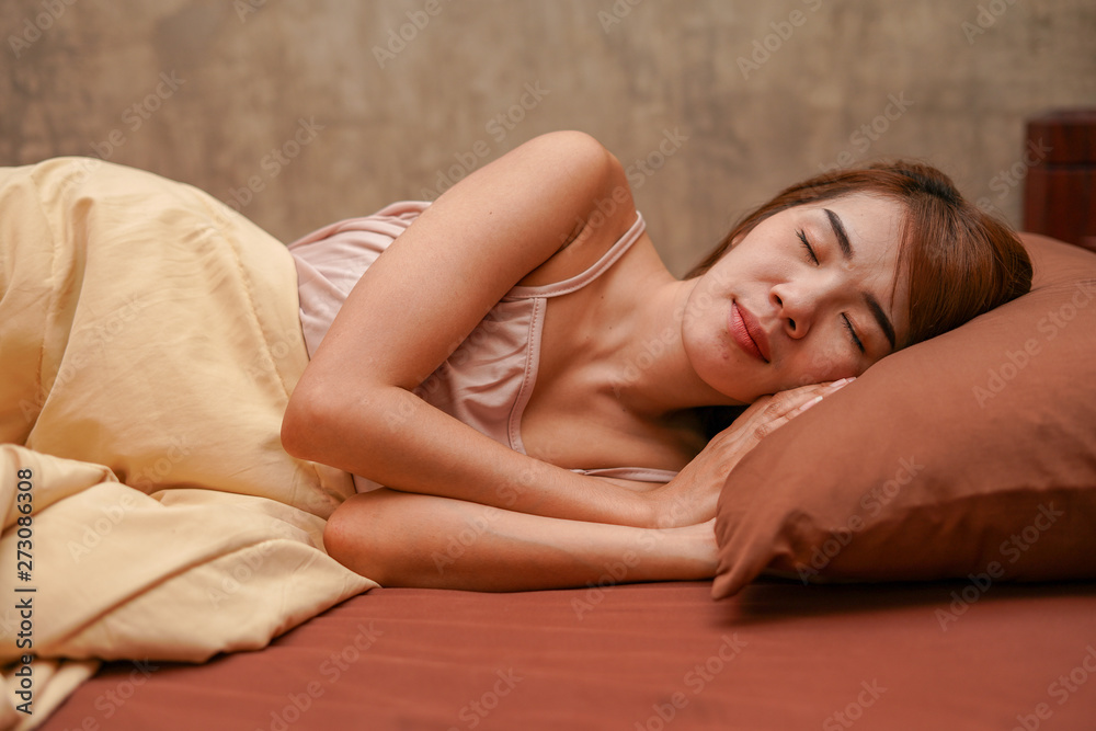Obraz premium Young beautiful woman sleeping in bedroom, dream, good night sleep concept.