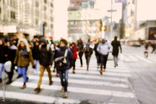 Blurry abstract background image of people walking on busy street