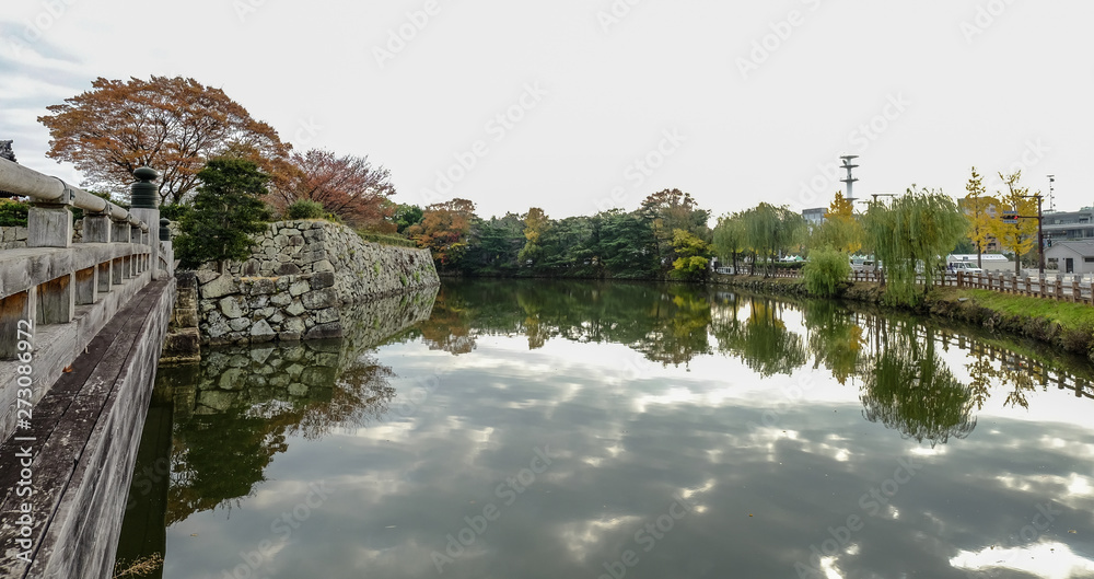 Moat of Himeji Castle in autumn