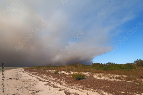 Smoke from a wildfire over the beach and Gulf of Mexico on East Cape Sable in Everglades National Park, Florida.