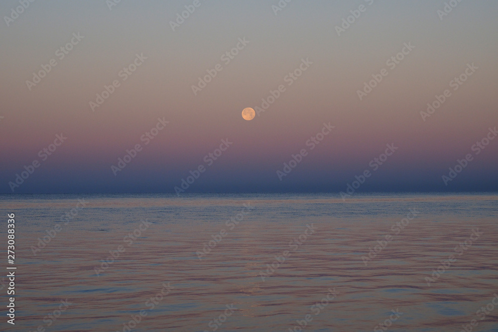 The setting moon over the Gulf of Mexico off East Cape Sable in Everglades National Park, Florida.