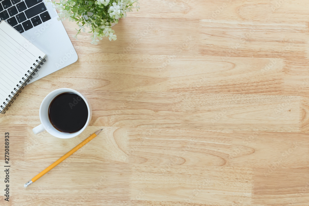 Flay lay, Top view office table desk with smartphone, keyboard, coffee, pencil, leaves with copy space background.