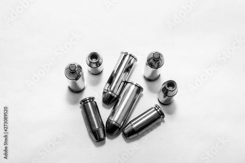 Eight different bullets, four 44spl and four 40 caliber ones shot in black and white photo