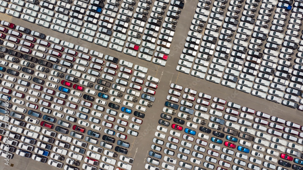 Aerial Top view of new cars lined up at Industrial factory Port, Logistics import - export and transportation concept Aerial Top view of new cars lined up at Industrial factory Port, Logistics import - export and transportation concept