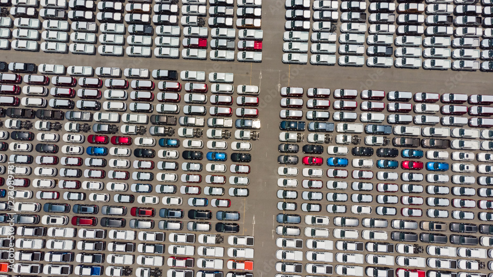 Aerial Top view of new cars lined up at Industrial factory Port, Logistics import - export and transportation concept Aerial Top view of new cars lined up at Industrial factory Port, Logistics import - export and transportation concept