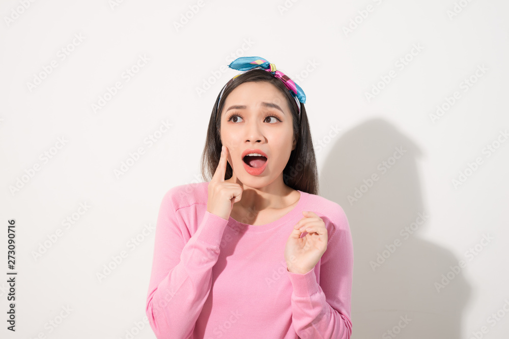 Young beautiful Asian woman scared of sunshine isolated over white background. Concept for summer skin care and skin protection from uv sunshine Young beautiful Asian woman scared of sunshine isolated over white background. Concept for summer skin care and skin protection from uv sunshine