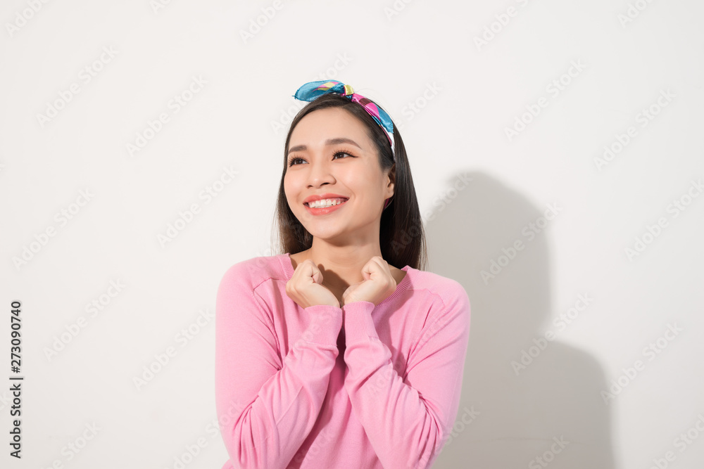Surprised woman with hands up amazed or shocked by unexpected news holding close palms up and showing happy expression. Young adult woman on white background Surprised woman with hands up amazed or shocked by unexpected news holding close palms up and showing happy expression. Young adult woman on white background