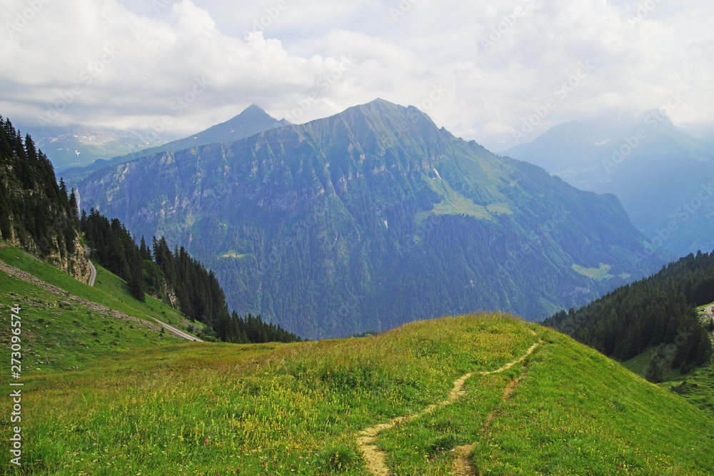 Alpine peaks landskape background. Jungfrau, Bernese highland. Alps, tourism, journey and hiking.