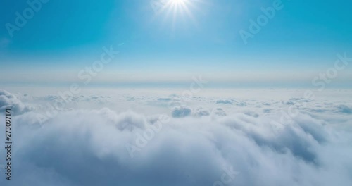 The sun shines on the rolling sea of clouds - Mount Emei in Sichuan Province, China photo