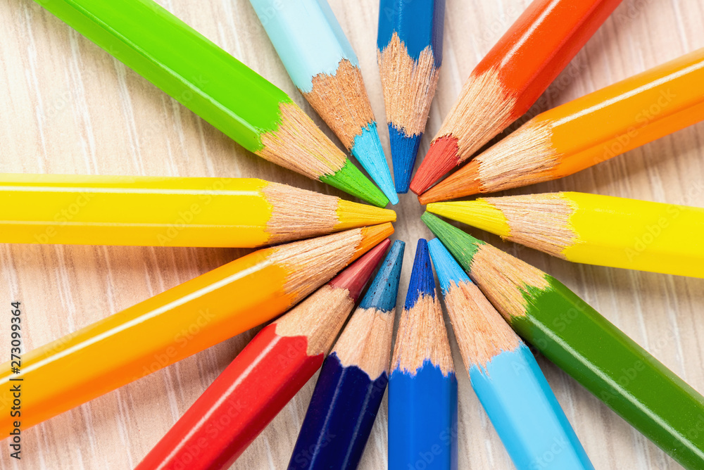 Color pencils in a circle on a white background. Drawing with colored pencils. Color pencils in a circle on a white background. Drawing with colored pencils.