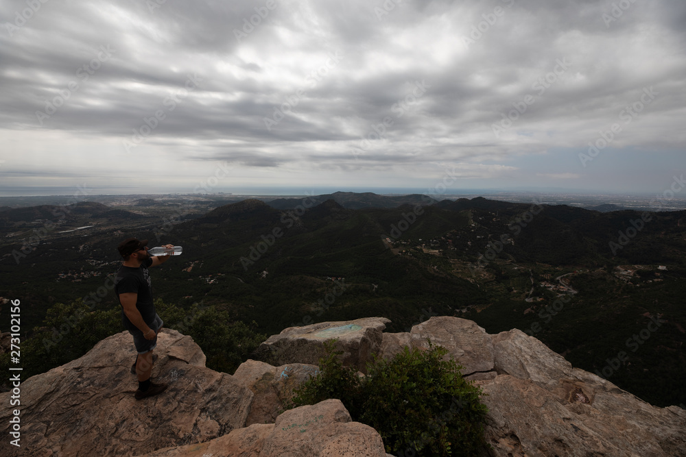 Panoramic View Of Tourist On Mountain Peak