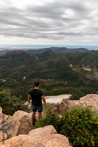 Panoramic View Of Tourist On Mountain Peak