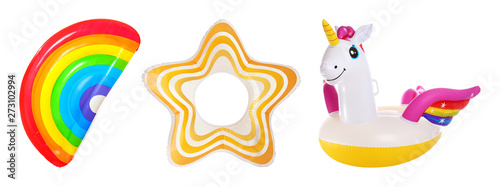 Set of bright inflatable rings and mattress on white background
