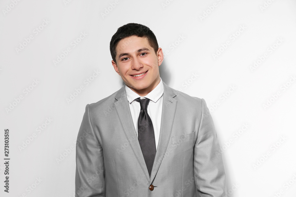 Portrait of young businessman on light background Portrait of young businessman on light background
