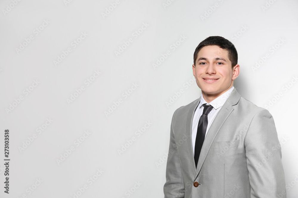 Portrait of young businessman on light background. Space for text Portrait of young businessman on light background. Space for text