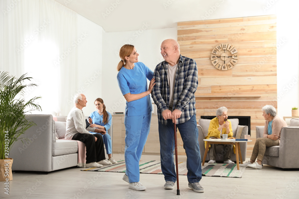 Nurses assisting elderly people at retirement home Nurses assisting elderly people at retirement home