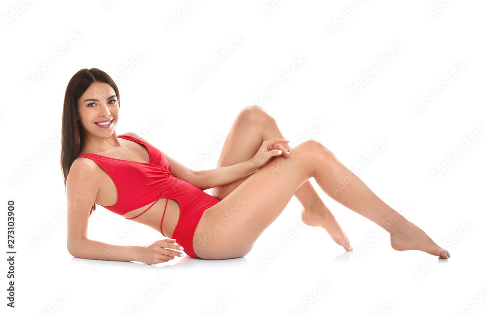 Full length portrait of attractive young woman with slim body in swimwear on white background