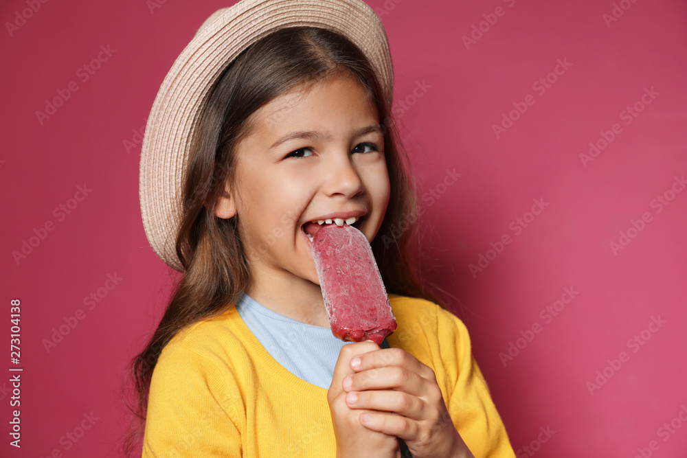 Adorable little girl with delicious ice cream against color background Adorable little girl with delicious ice cream against color background