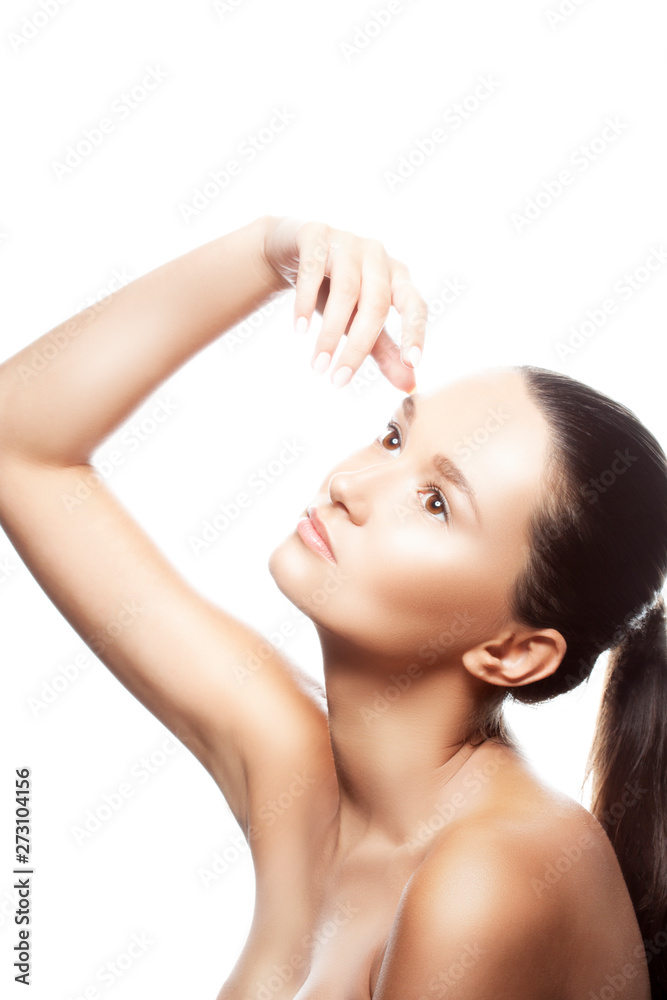 Beautiful portrait of young pretty woman with perfect skin, natural nude make-up, hand near head, natural nude make-up. Isolated. White background. Beauty treatment concept Beautiful portrait of young pretty woman with perfect skin, natural nude make-up, hand near head, natural nude make-up. Isolated. White background. Beauty treatment concept