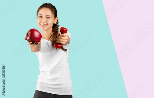 Portrait of girl with red apple isolated