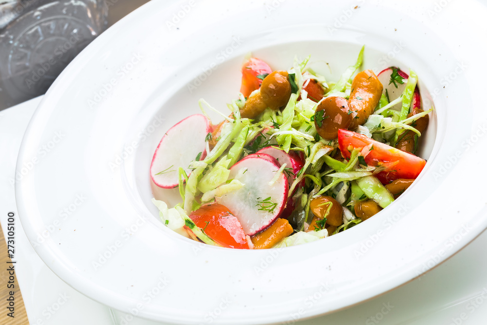 A fresh bowl of homemade coleslaw with dressing A fresh bowl of homemade coleslaw with dressing