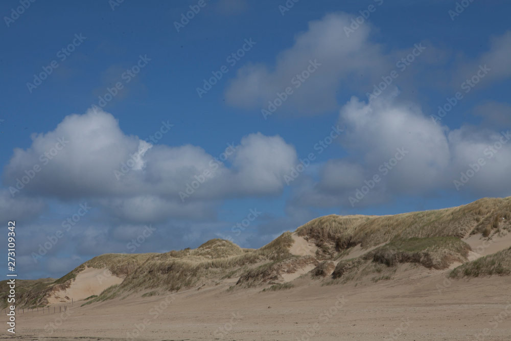 Dutch coast. Beach and dunes at Northsea Netherlands. Clouds. Dutch coast. Beach and dunes at Northsea Netherlands. Clouds.
