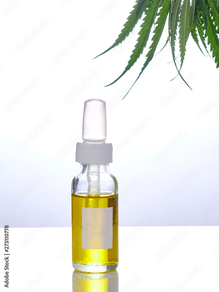 Cannabis with extract oil in a bottle