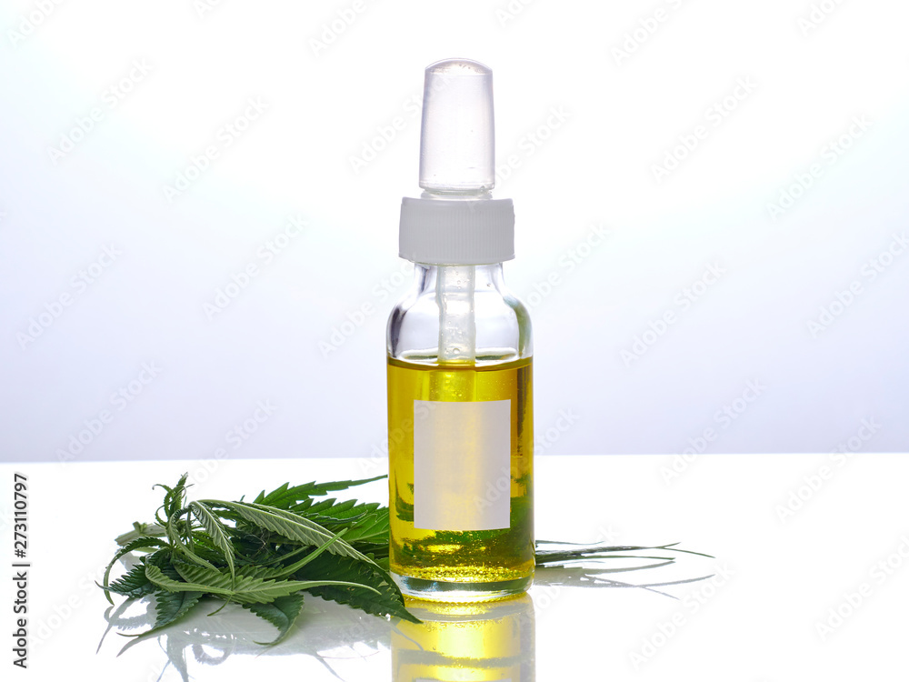 Cannabis with extract oil in a bottle