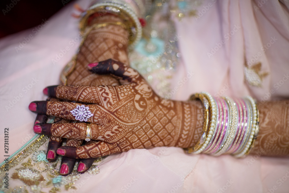 Beautiful bridal mehndi on Indian brides hands