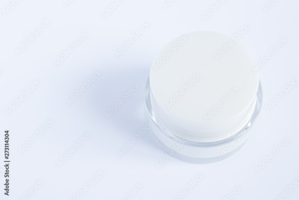 Top view of Daily face cream. Organic natural cosmetic product. Jar with cream and flowers on white background. Woman's skincare routine.Cope space. Top view of Daily face cream. Organic natural cosmetic product. Jar with cream and flowers on white background. Woman's skincare routine.Cope space.