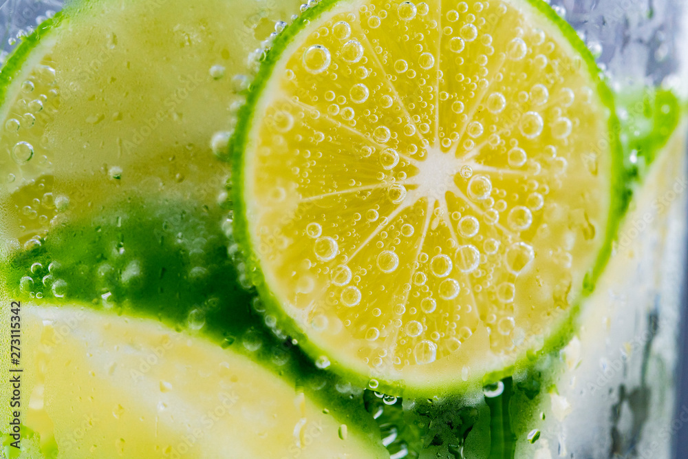 Close up lemon slice in soda water. Close up lemon slice in soda water.