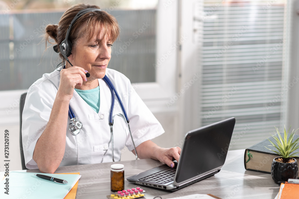 Portrait of female doctor during online medical consultation Portrait of female doctor during online medical consultation