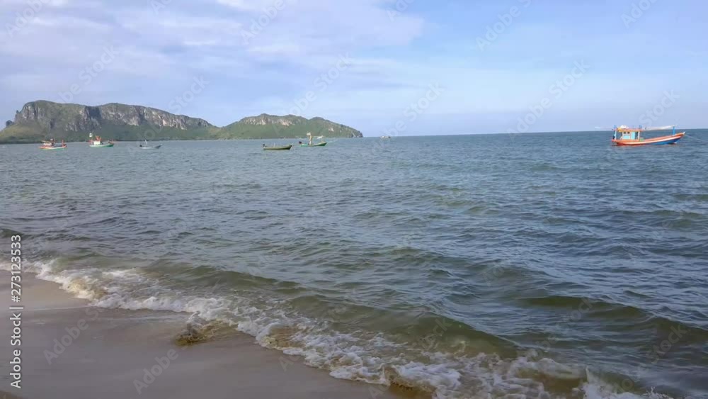 Waves in the ocean and sand on the beach, blue sky sunny day in Thailand