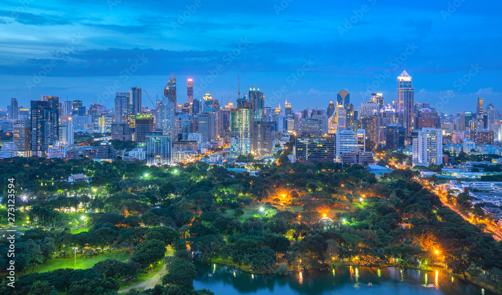 Evening cityscape at Lumpini park from at Bangkok , Thailand.