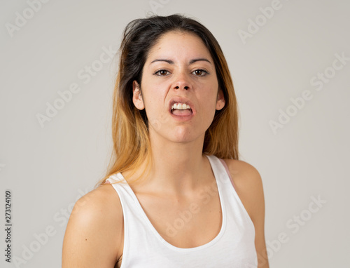 Human expressions and emotions. Desperate young attractive woman with angry face looking furious