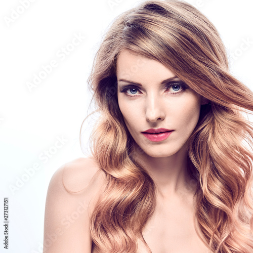 Beauty fashion woman portrait. Sensual young blonde with trendy wavy hairstyle healthy skin, makeup. Beautiful smiling positive model girl, fashionable styling curly hair. Skincare make up concept