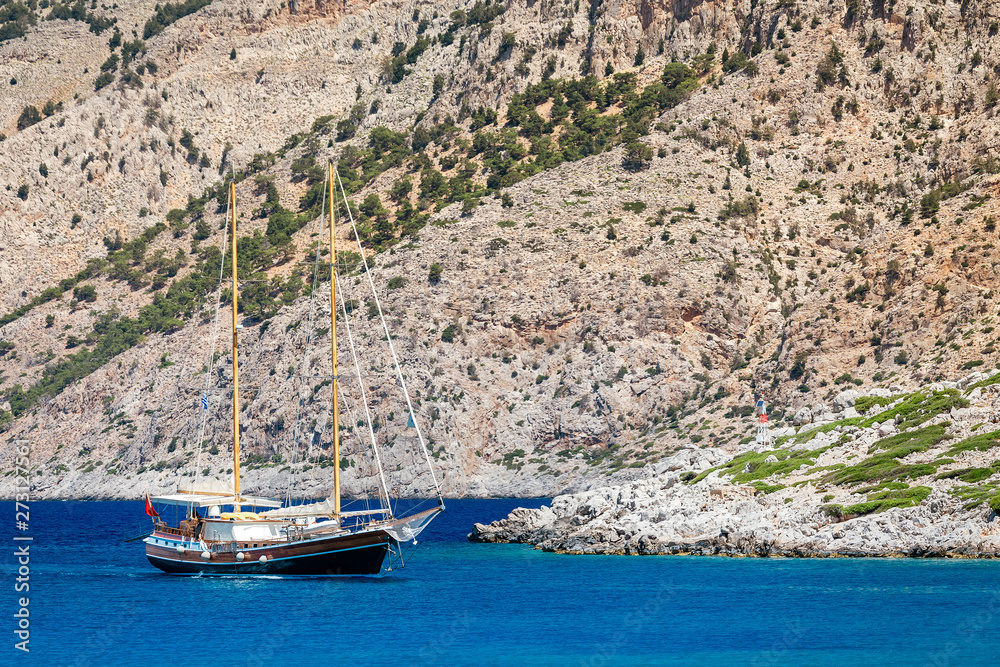 The modern yacht stylized to the retro two-masted vessel brig for entertainment and transportation of tourists
