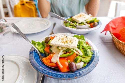 greek salad with feta cheese in a plate at the restaurant