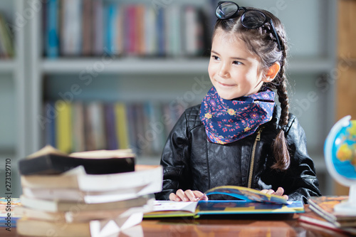 little foreigner girl learning,playing with happy in the classroom. photo