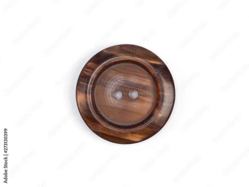 Brown plastic button on white background Brown plastic button on white background