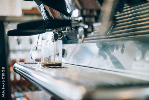 maker pouring espresso coffee
