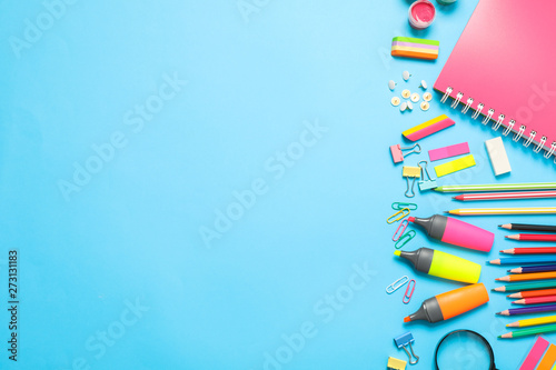 Flat lay composition with school supplies on color background, space for text