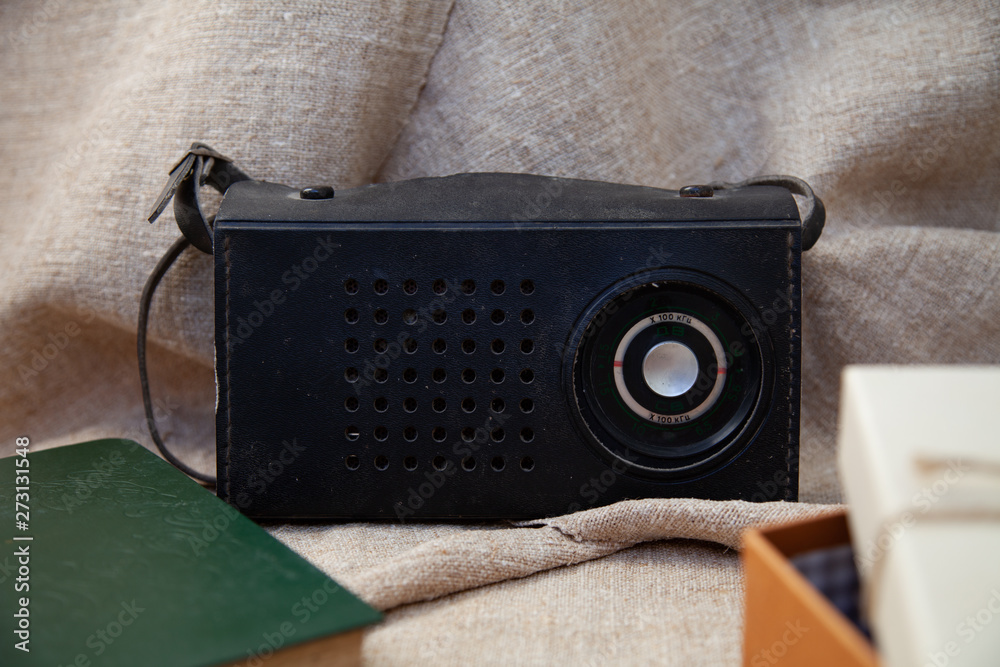 Fototapeta premium old soviet tape recorder on a flax texture background