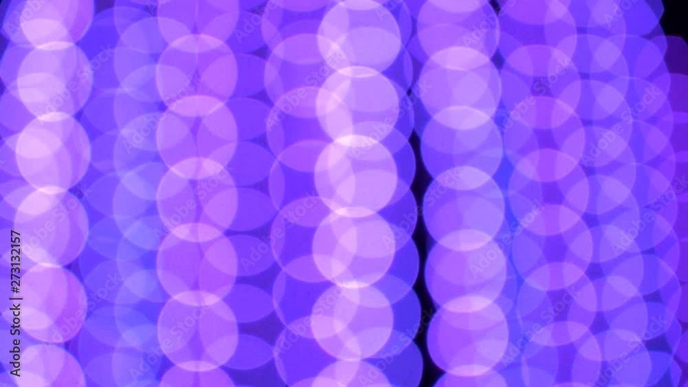 Blurry multicolored garland with glowing lights. Christmas, new year, birthday and wedding concept . Blurred background, bright colored light bulbs, lights, the light from the garland Blurry multicolored garland with glowing lights. Christmas, new year, birthday and wedding concept . Blurred background, bright colored light bulbs, lights, the light from the garland
