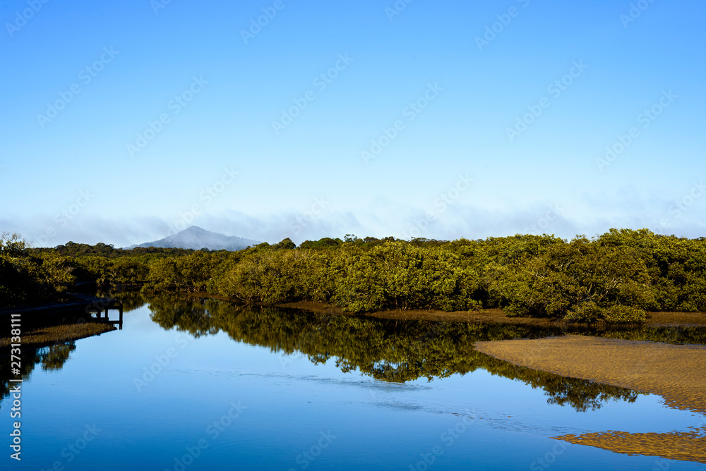 Landscape of Urunga Lagoon, with mountain in the background. Landscape of Urunga Lagoon, with mountain in the background.