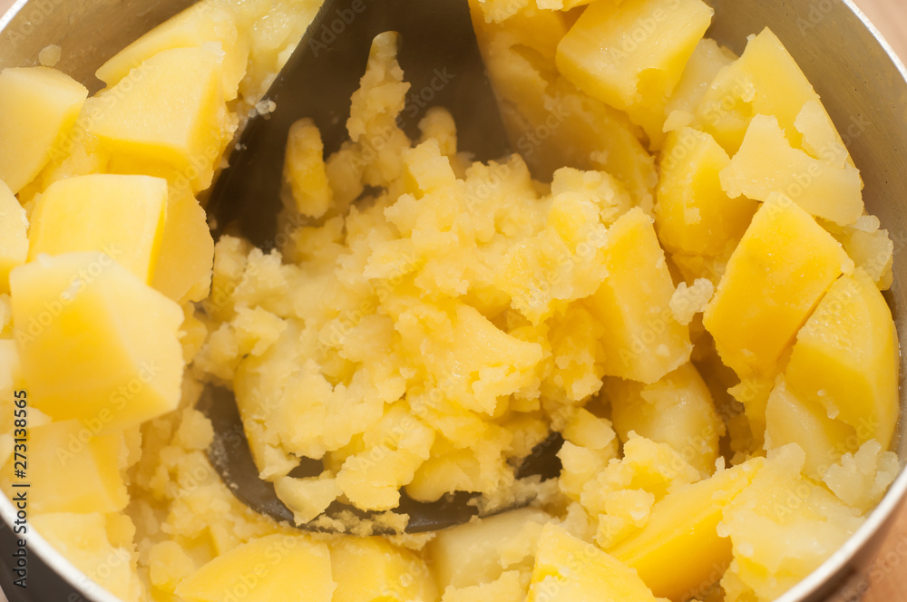 Treatment of rhinitis and cough with steam inhalations from hot boiled potatoes. Kitchen tools press for mashed potatoes. Treatment of rhinitis and cough with steam inhalations from hot boiled potatoes. Kitchen tools press for mashed potatoes.