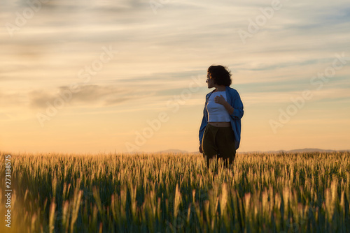  Young woman outdoors doing activities, with casual and modern style.