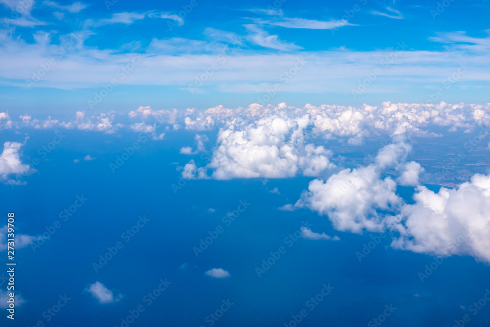 Clouds over the sea. Blue sky with white clouds