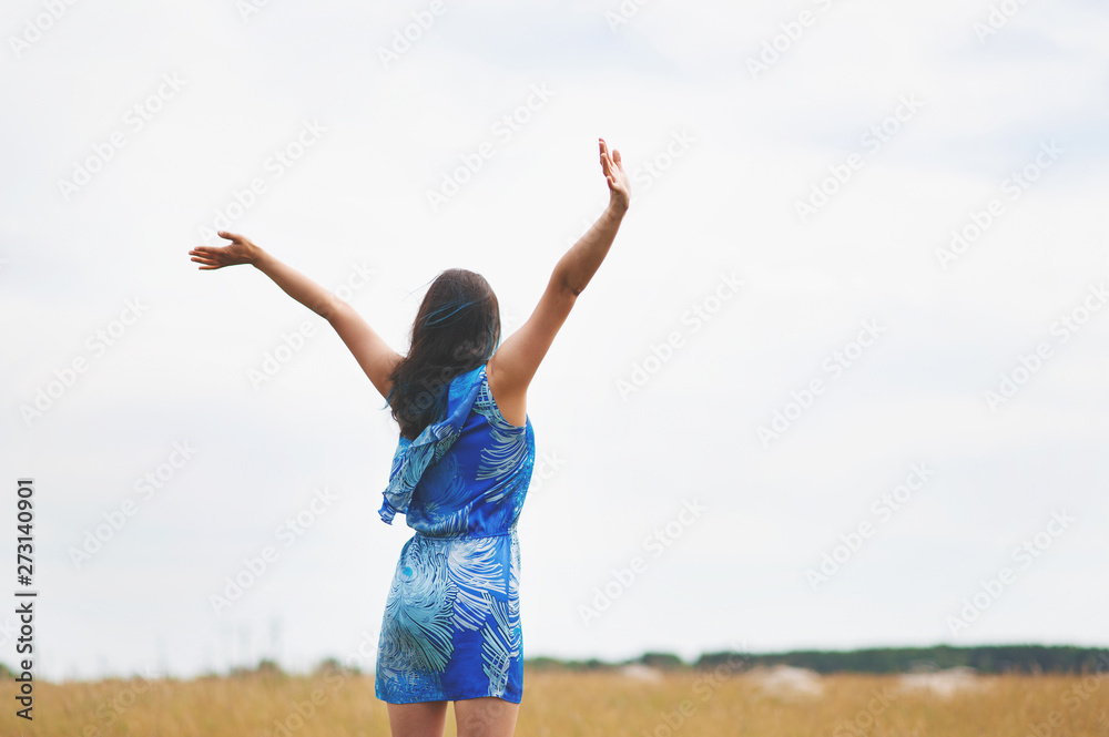 woman standing in the field concept of freedom woman standing in the field concept of freedom